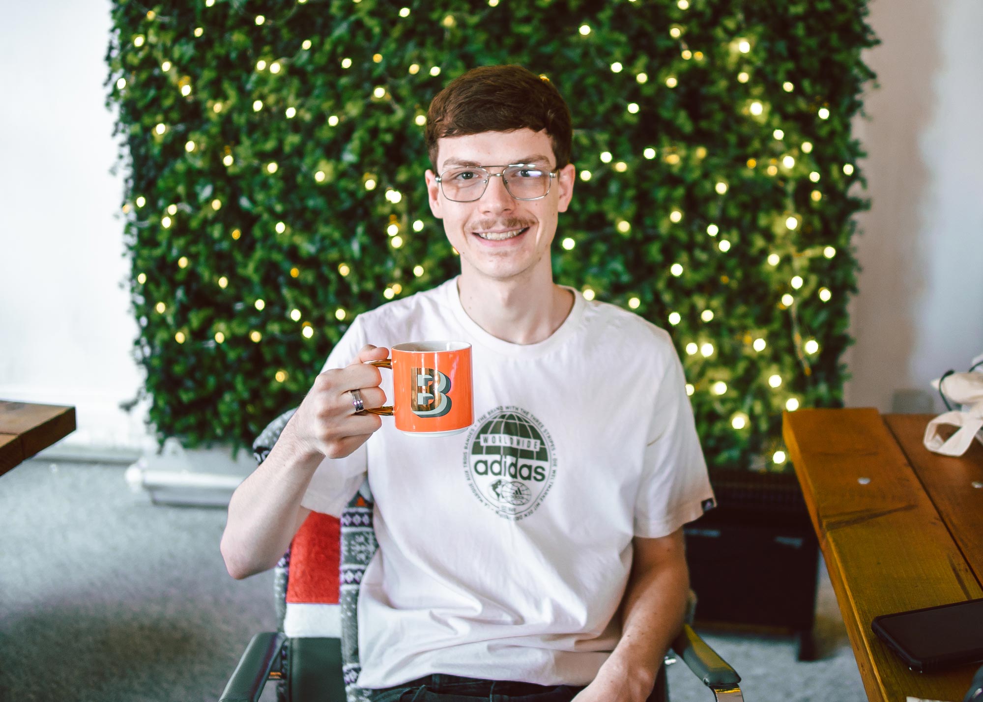 Content producer, Ben, holding a mug of tea. December 2022.